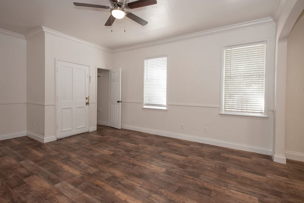 Living room area with plank style flooring at Clarendon House in Sacramento, California