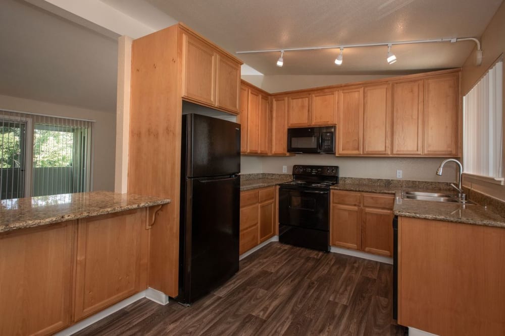 Spacious kitchen area at Castle Hill Apartments in Sacramento, California