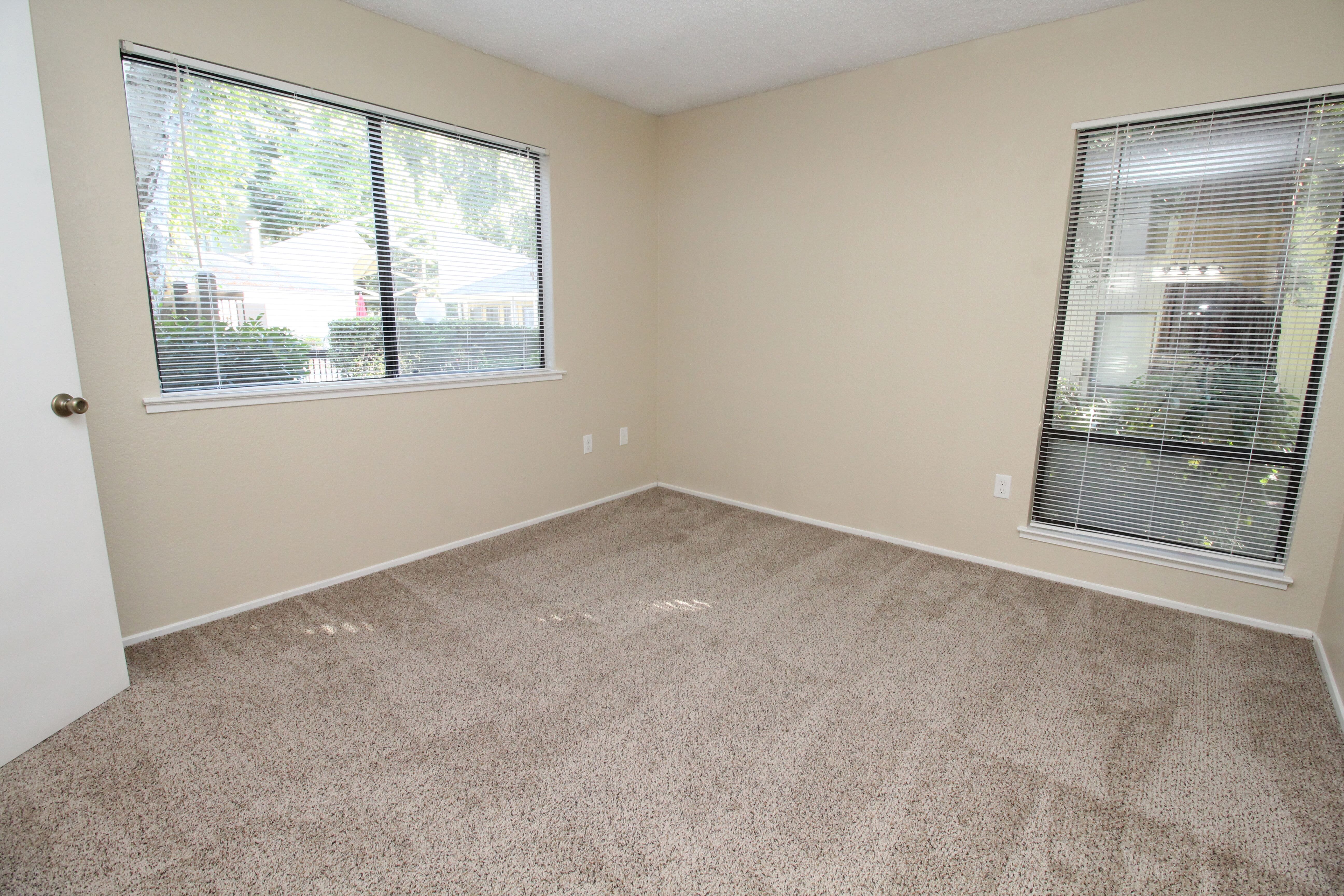 Well-lit bedroom at Huntcliffe Apartments in Fair Oaks, California